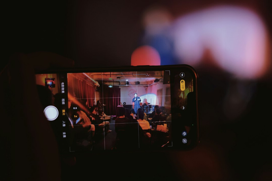 filmmaker using smartphone on set